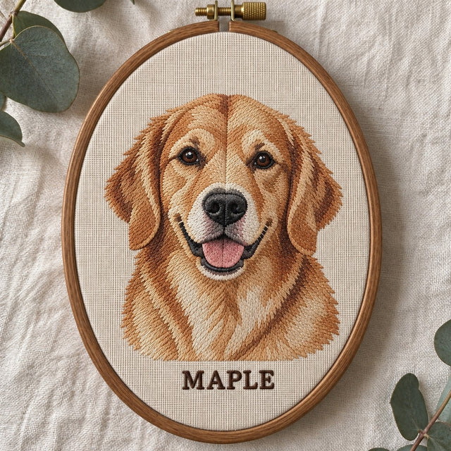 Machine-embroidered golden retriever portrait with the name MAPLE, in an oval wooden hoop
