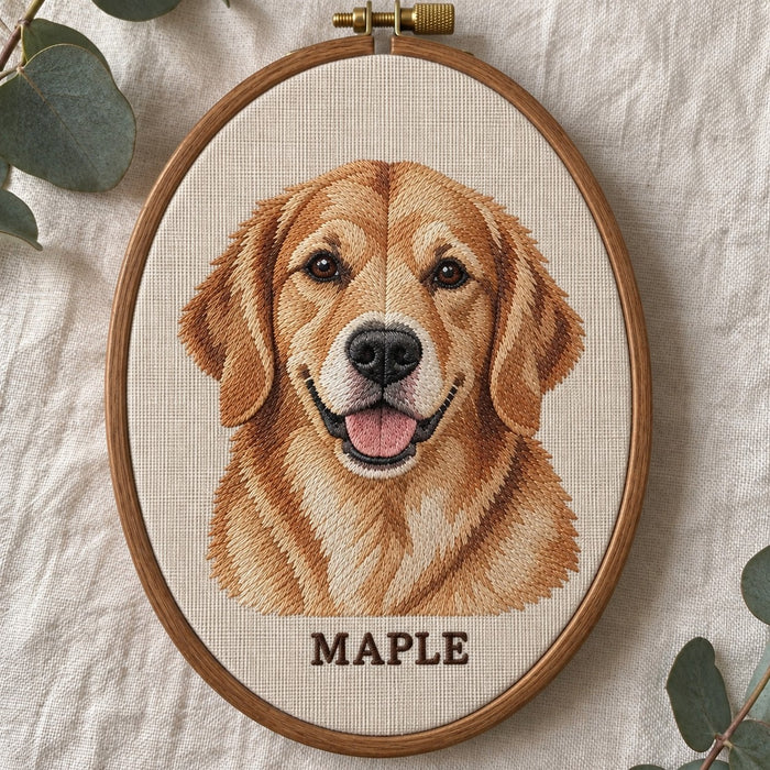 Machine-embroidered golden retriever portrait with the name MAPLE, in an oval wooden hoop