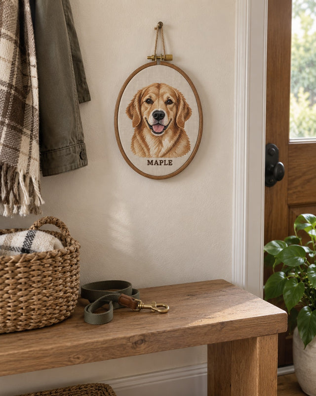 Embroidered pet portrait hoop hanging on an entryway wall