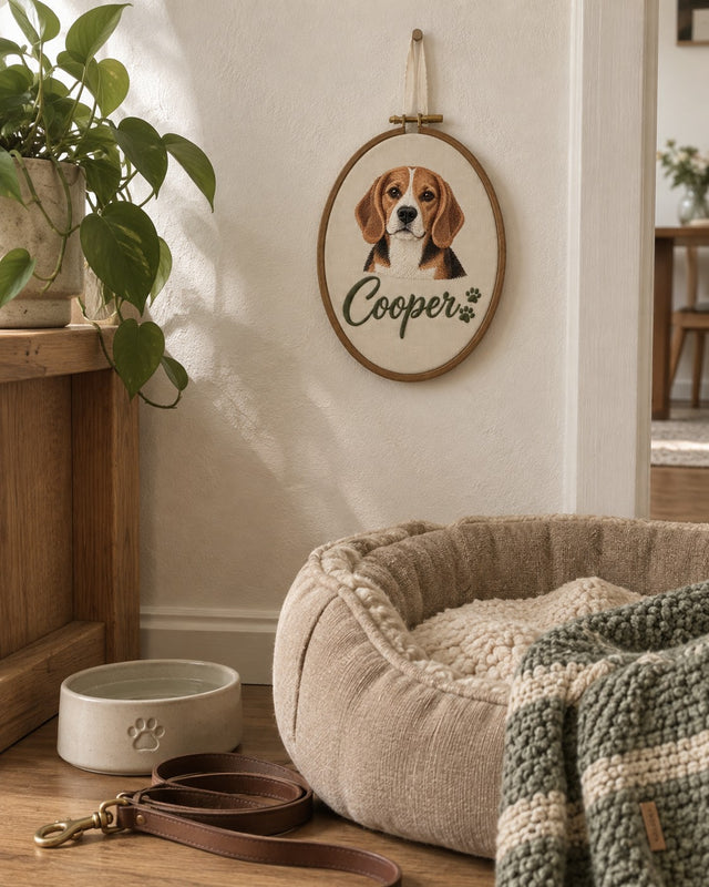 Pet name hoop hanging on a wall above a cosy dog bed