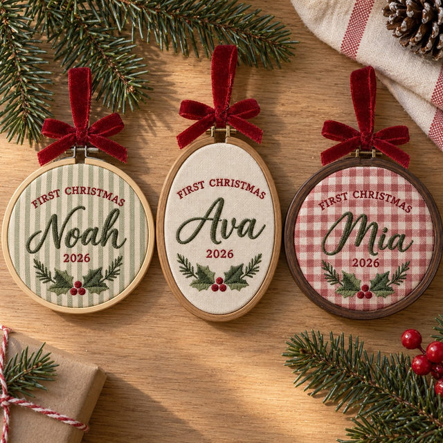 Three First Christmas ornament hoops: bamboo round on sage stripe, oval on cream linen, walnut-look round on red gingham